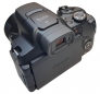 Ultrazoom Canon PS-SX70 HS v zadní perspektivě těla